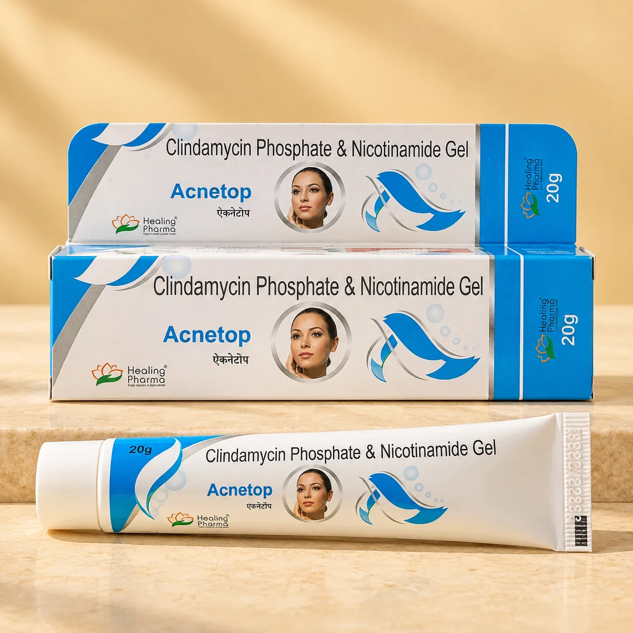 Acnetop Clindamycin Phosphate and Nicotinamide Gel 20g by Healing Pharma, box and tube on a warm stone surface