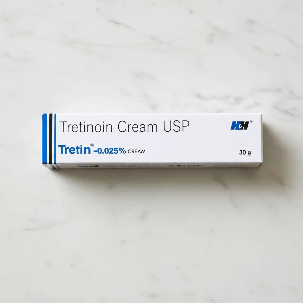 Box of Tretin 0.025% Tretinoin Cream USP by H&H placed on marble surface.
